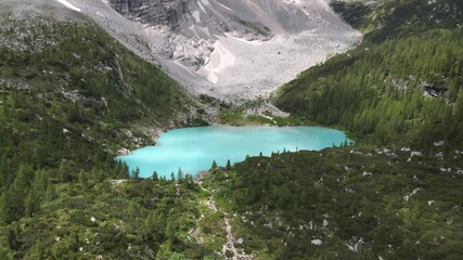 Aerial Vertical Pan Shot Of Ice Blue Glacial Lake, Lago Di Sorapiss, Dolomites, Italy - Powered by Adobe