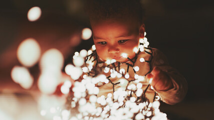 Beautiful baby girl playing with fairy lights with Sail Champagne colours 4