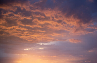 Naklejka na ściany i meble Beautiful golden clouds, sunset sky