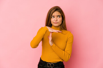 Young skinny caucasian teenager girl showing a timeout gesture.