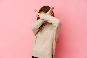 Young skinny caucasian teenager girl keeping two arms crossed, denial concept.
