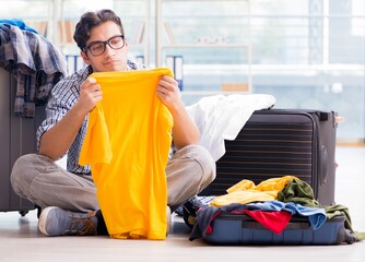 Young man preparing for vacation travel