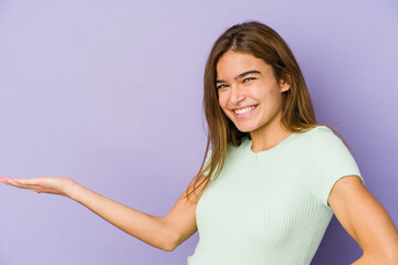 Young skinny caucasian girl teenager on purple background showing a welcome expression.