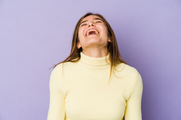 Young skinny caucasian girl teenager on purple background relaxed and happy laughing, neck stretched showing teeth.