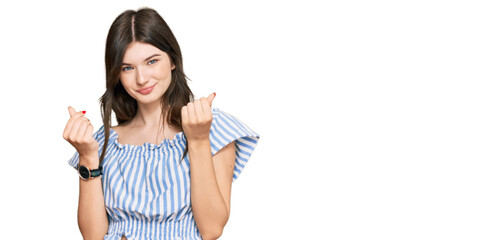 Obraz premium Young beautiful caucasian girl wearing casual clothes doing money gesture with hands, asking for salary payment, millionaire business