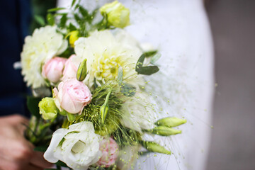 Festive bouquet with flowers decorated with leaves