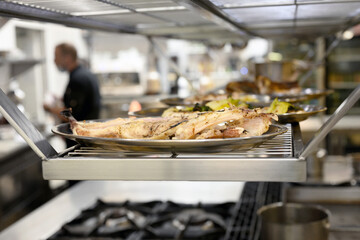 Food being cooked in commercial stainless steel kitchen in restaurant. High quality photo