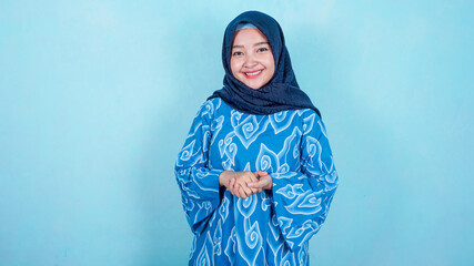 Image of happy asian hijab business woman posing isolated background