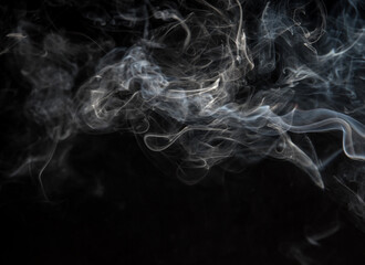Abstract puffs of smoke on a black background.