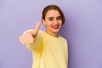 Young arab mixed race woman smiling and raising thumb up