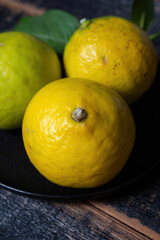 Fresh ripe bergamot orange fruits, fragrant citrus used in earl grey tea, medicine and spa treatments