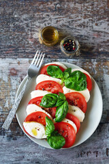 Traditional Italian caprese salad on a plate. Healthly food.