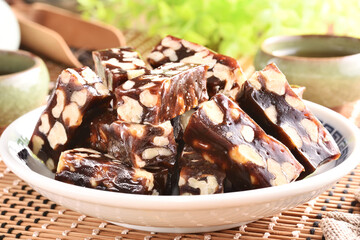 Walnut with Date Cake  on the white plate