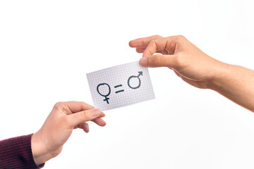 Cardboard banner with female and male symbol, women and men are equal message over isolated white...