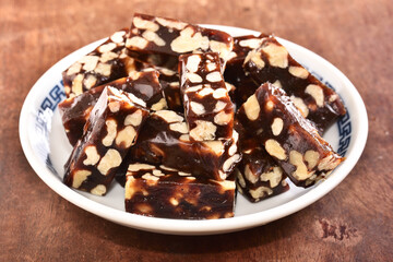 Walnut with Date Cake  on the white plate