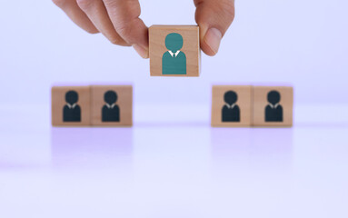 Wooden blocks with people icon on blue background, Human resource management and recruitment concept