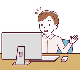 A man in a pink shirt using a computer