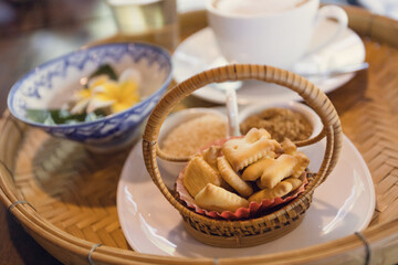 Cappuccino coffee served in a Thai style coffee shop