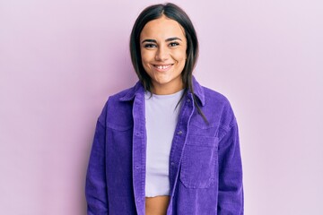 Young brunette woman wearing casual clothes with a happy and cool smile on face. lucky person.