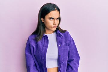Fototapeta premium Young brunette woman wearing casual clothes skeptic and nervous, frowning upset because of problem. negative person.
