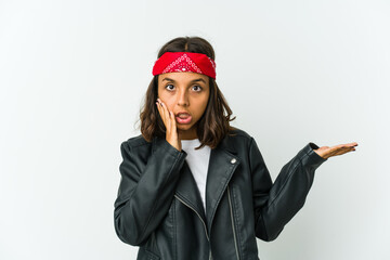 Young latin rocker woman isolated on white background