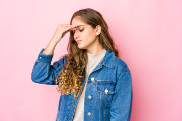 Young caucasian woman having a head ache, touching front of the face.