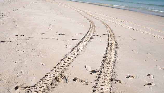4x4 tyre tracks crisscrossing Tire tracks on the sand texture background