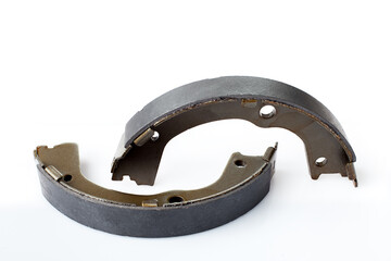 kit of drum brake pads with asbestos alloy on steel car spare parts, view hand brakes isolated on...