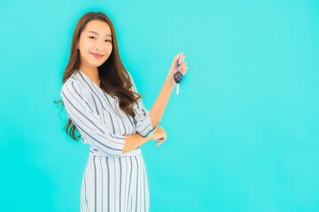 Portrait beautiful young asian woman with car key