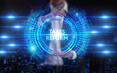 Business, Technology, Internet and network concept. Young businessman working on a virtual screen of the future and sees the inscription: Taxes reform