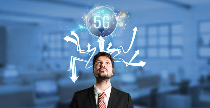 businessman with a virtual world map with message 5G over his head in front of an office background
