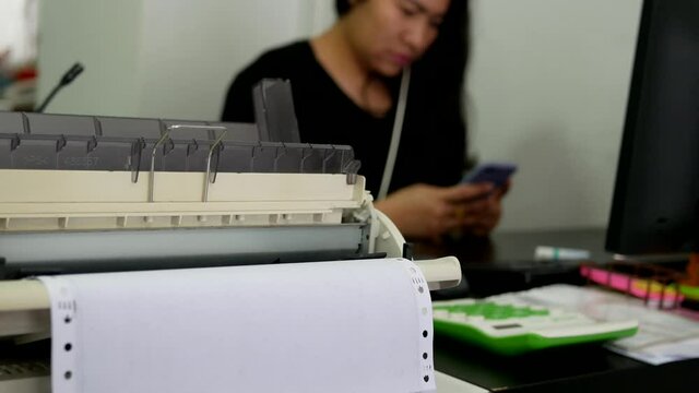 closeup of continuous paper printer in the office.