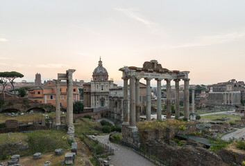 Fototapeta na wymiar Sunrise landscapes of the empty Roman Forum, view of the Temple of Vespasian and Titus
