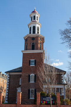 Alexandria, VA, USA 11-29-2020: Close up vertical  image of the historic Christ Church. This brick building with a tower was buit in 1773 as the main Church of England in the neighborhood.