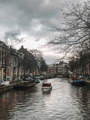 Fototapeta na wymiar boat on river in Amsterdam