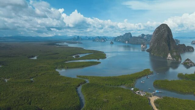 Flying through the spectacular mountain landscape of Samed Nang Chee popular tourist place in Thailand , Aerial view of the gorgeous tropical amazing mountains and the ocean blue