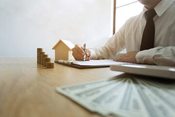 Businessmen calculate investment expansion business, saving money .finance concept .