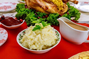 Mashed potatoes, gravy and turkey for Christmas or Thanksgiving Day.