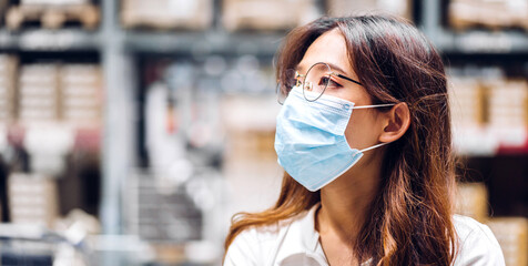 Young beautiful asian woman in quarantine for coronavirus wearing surgical mask face protection with social distancing at city.covid19 concept