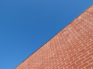 The border between the red brick wall and the sky
