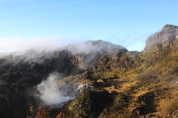 beautiful rock hill on top volcanic mountain in central java indonesian, wildlife nature landscape with cloudy background wallpaper photo
