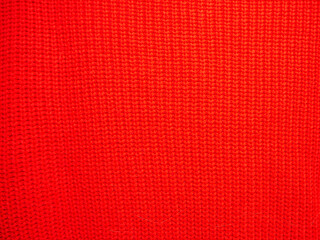 Background, texture, surface of wool knitted fabric from yarn, closeup. Image for the background, wallpaper. wool carpet or sweater. brown texture. Modern design.