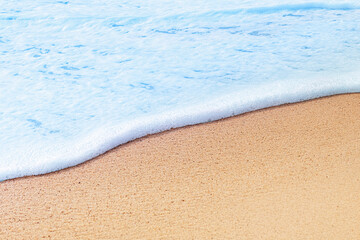 Fototapeta na wymiar Foam wave on sea beach