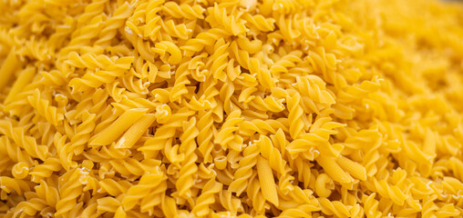 lose up of spiral macaroni pasta uncooked