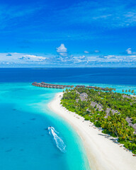 Maldives paradise scenery. Tropical aerial landscape, seascape with long jetty, water villas with...