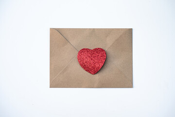 One envelope with one red heart. love Valentine day on 14th February. Send love latter, small gift, confession of love to beloved. craft envelope