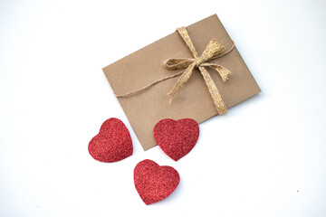 One envelope with many red heart. love Valentine day on 14th February. Send love letter, small gift, confession of love to beloved. craft envelope
