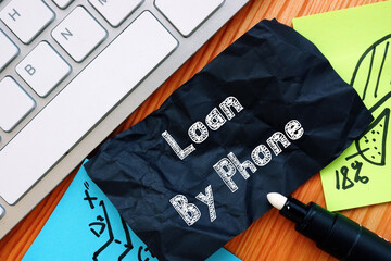Financial concept about Loan By Phone with phrase on the piece of paper.