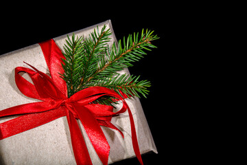 Christmas gift with red bow on black background