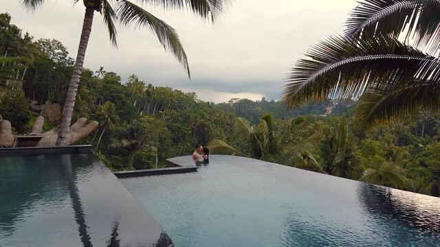 couple kissing inside the pool in Ubud Bali Indonesia